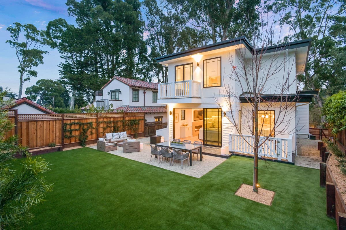 Two-story home exterior with backyard patio